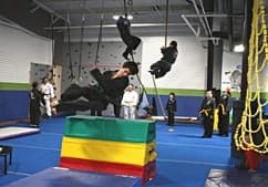 Ninjai Warrior students moving through the Academy obstacle course