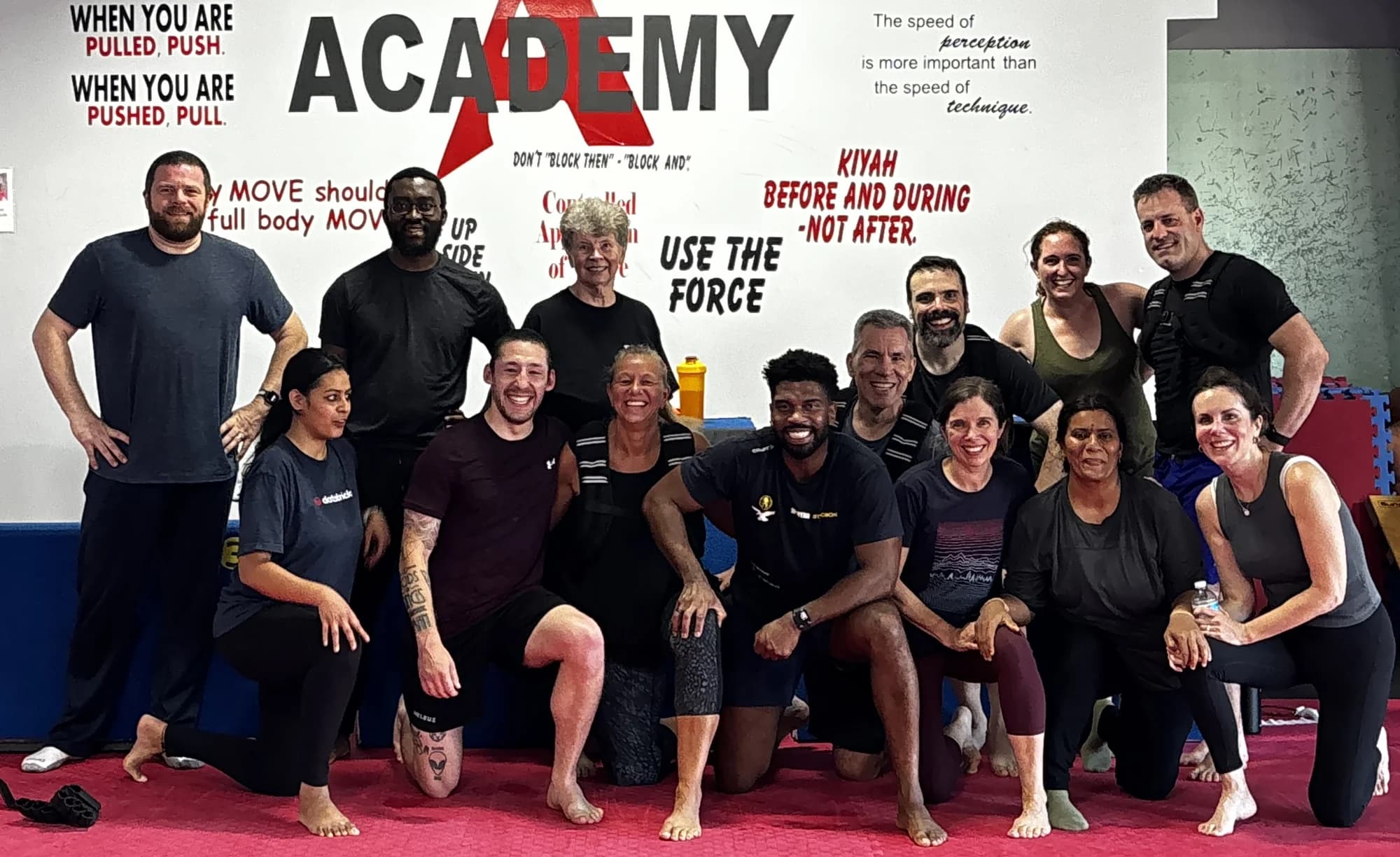 Academy members smiling together after a group training session